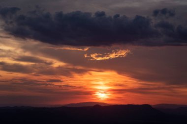 Beautiful orange clouds on sunset sky in Chapada dos Veadeiros, Gois State, Central Brazil 