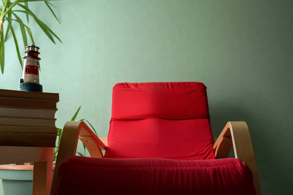 open book on a red armchair