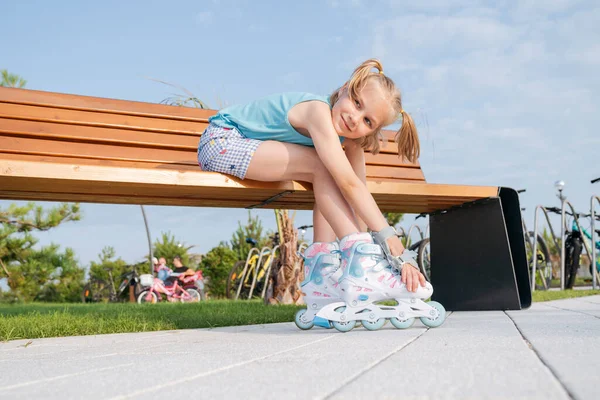 Girl Roller Skates Sitting Park Bench — Stockfoto