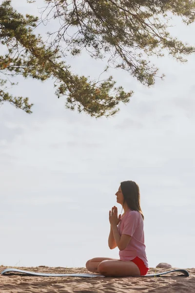 Woman Lotus Position Meditates Beach Pines — ストック写真