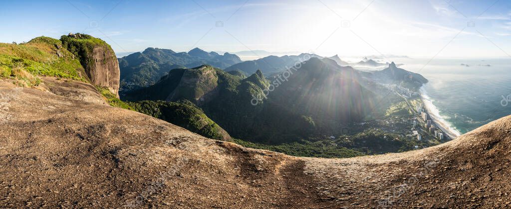 Beautiful view to green mountains, city and rainforest from Pedra da Gavea, Tijuca National Park, Rio de Janeiro, Brazil