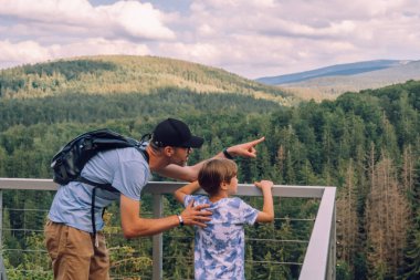 Father and son looking spring landscape of Giant Mountains - Karkonosze Mounatains, Poland
