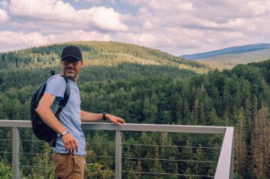 man looking spring landscape of Giant Mountains - Karkonosze Mounatains, Poland