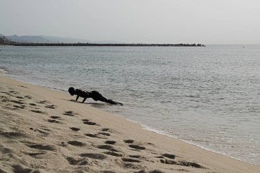 Professional sportsman aqua training in the sea