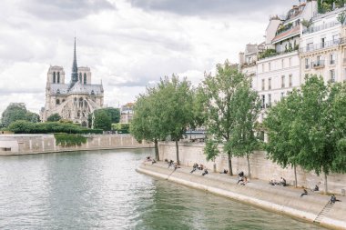 View of Notre Dame cathedral along the Seine River in Paris, France