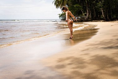 woman in swimsuit on the beach in Costa Rica