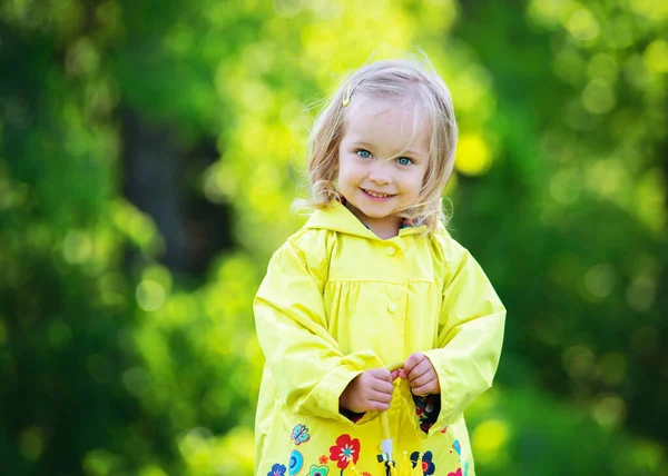 Blond Toddler Girl Yellow Raincoat — Stockfoto