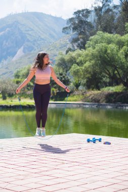 Young sportswoman outdoors doing various activities.