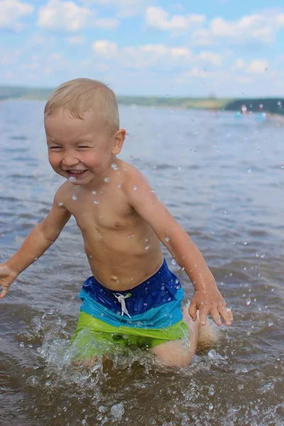 Child Splashing Water Squints — Stok fotoğraf
