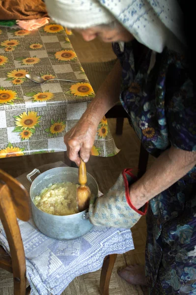 Old Grandmother Cooking Ground Potatoes Pounding Woodenware Aluminum Pot — Fotografia de Stock