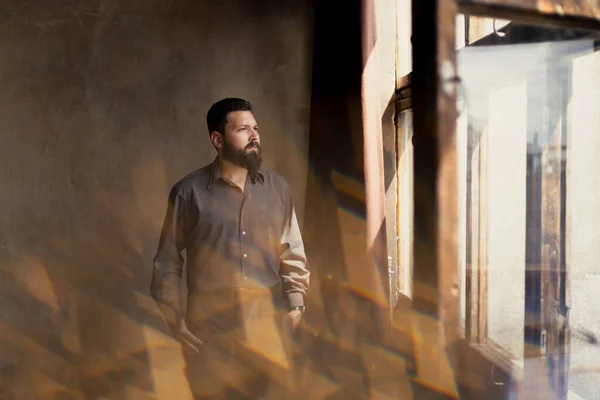 Young Bearded Man Suit Looks Out Window — Foto Stock