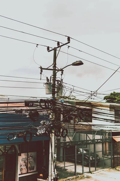 telephone cables tied to a lamppost in san jose