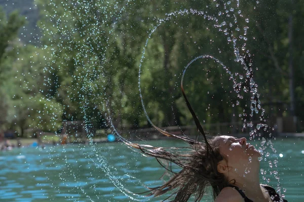 Long Haired Brunette Girl Waving Her Hair Water Splash Effect — Stockfoto