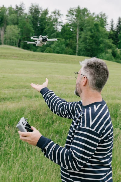 Male Hand Catching Drone Quadcopter Meadow Switzerland — Stock fotografie