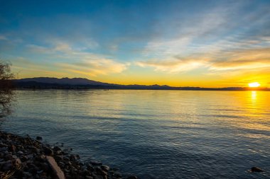 Sunset over a colorful cloudscape in twilight at the lagoon