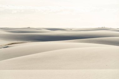 Beautiful view to blue rainwater lagoon and white sand dunes