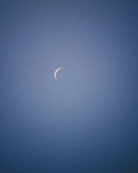 The new moon in the blue skies