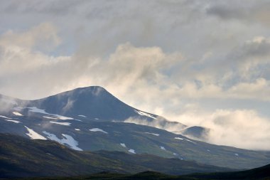 Clouds over mountainous terrain in morning