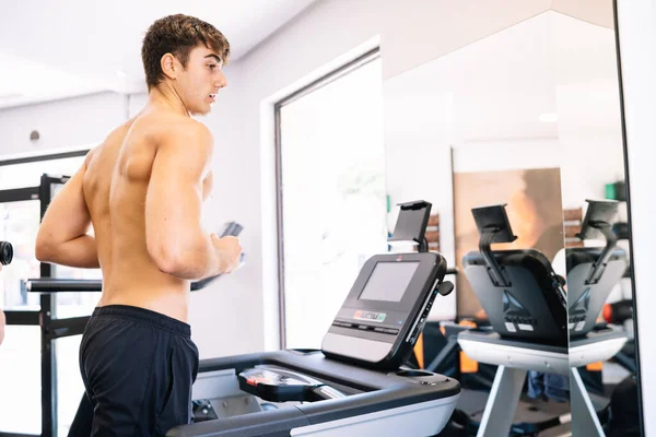 Shirtless Sportsman Exercising Treadmill Daytime — стоковое фото