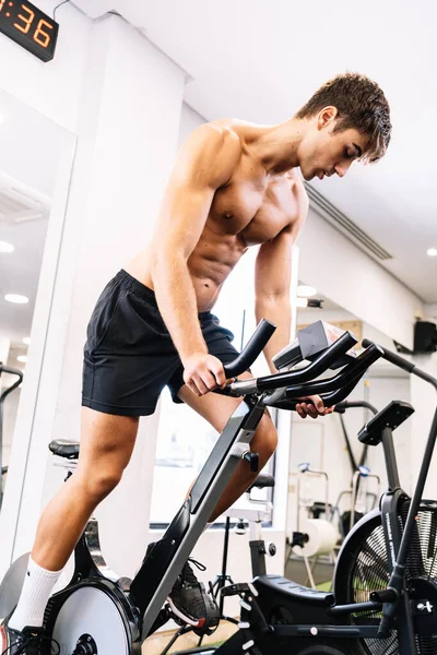 Determined Sportsman Exercising Bike Gym — Stockfoto