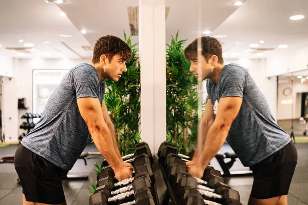 Male Athlete Taking Dumbbells Looking Mirror — 图库照片