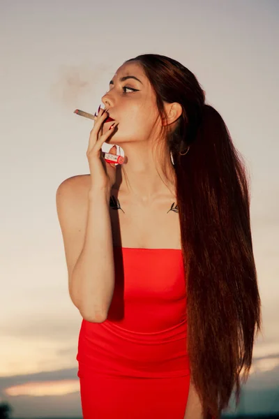 Girl Red Dress Smoking Marijuana Joint Sunset — Stok fotoğraf