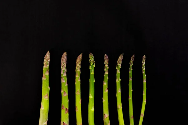 April World Asparagus Day Hand Holding Asparagus Black Background — Stock Photo, Image