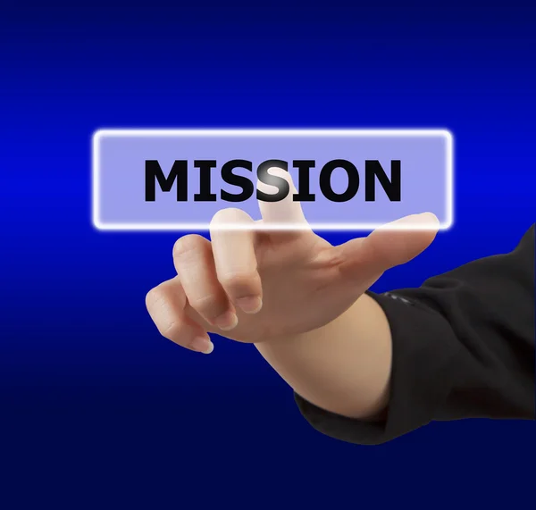 Woman hand touching button mission — Stock Photo, Image