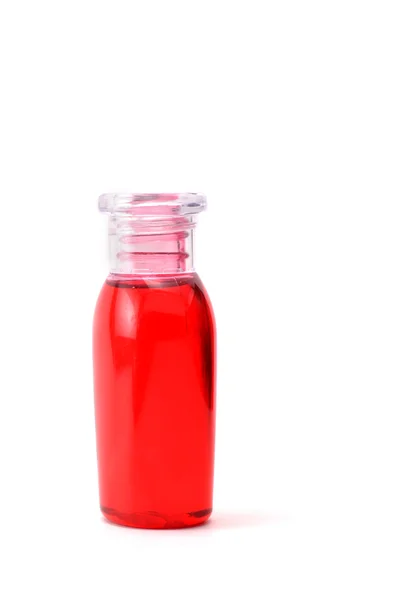 Red shampoo on white background — Stock Photo, Image