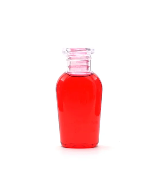 Red shampoo on white background — Stock Photo, Image