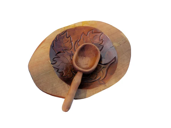 Wooden plate with a spoon. — Stock Photo, Image