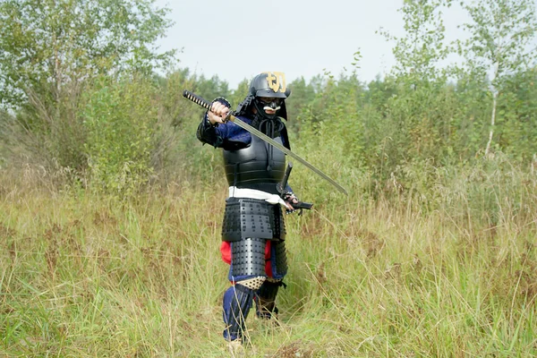 Samurai with sword in defense combat position — Stock Photo, Image