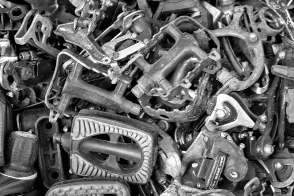 evocative black and white texture image of old bicycle pedals
