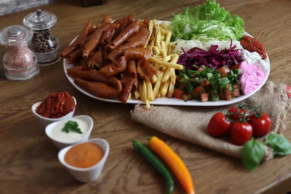 delicious meat doner on the serving plate and salad on the side
