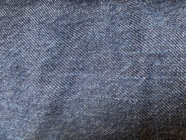 blue navy denim jeans fabric in the full-frame, using as background