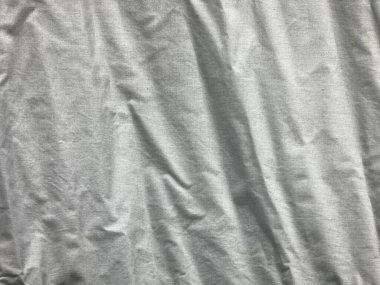 crinkled white linen fabric in full frame shot, using as background