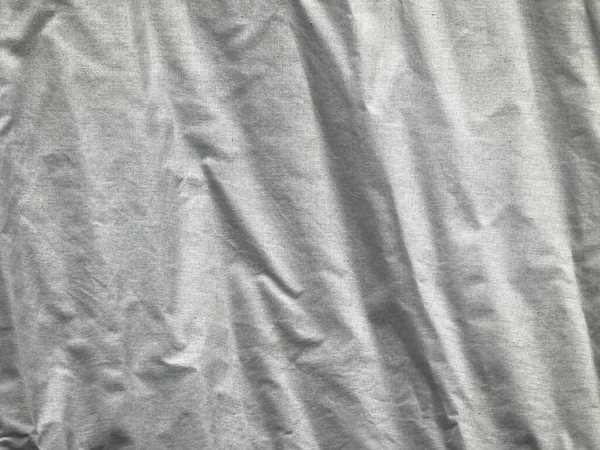 crinkled white linen fabric in full frame shot, using as background