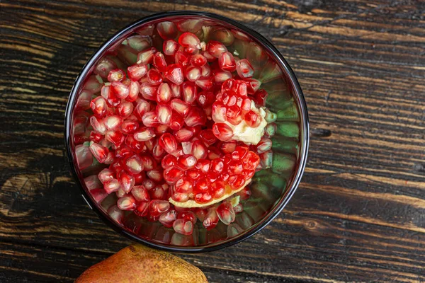 Pomegranate Seeds Glass Bowl Wooden Table — Stock Photo, Image