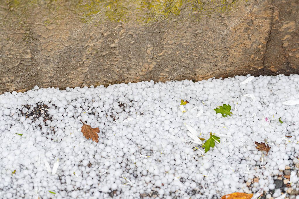 close-up shot of backyard floor covered with ice hail