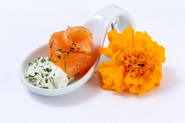 Finger food on a elegant spoon, salmon with cream cheese in a porcelain spoon