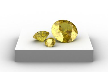 Beyaz podyum üzerinde sarı safir