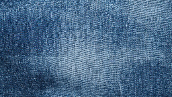 Blue jeans fabric background texture. Close up view.