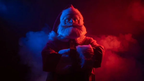 Santa claus in blue red smoke. Party for Christmas. — Stock Photo, Image