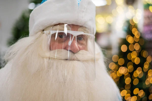 Portrait of russian santa claus in a protective visor. — Stock Photo, Image