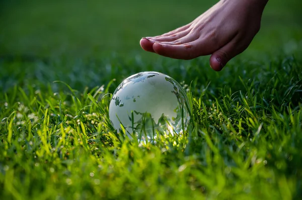 Close Crystal Globe Female Hand Green Lawn — Stock Photo, Image