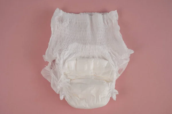 Woman wearing adult diaper against white background. 16251982