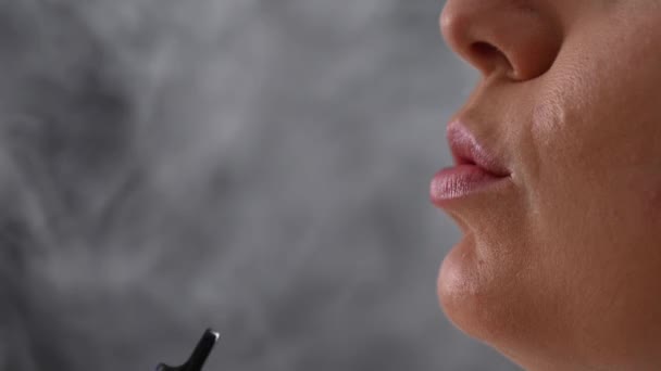 Caucasian Woman Smokes Disposable Vape Studio — Stock Video