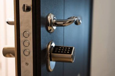 Open door to the apartment with a combination lock. Keyless entry clipart
