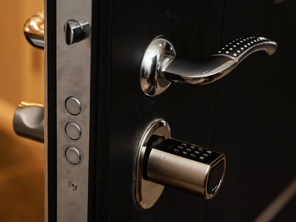 Open door to the apartment with a combination lock. Keyless entry