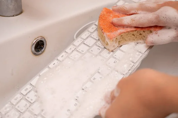 Woman Washing White Computer Keyboard Sponge Foam — Stockfoto